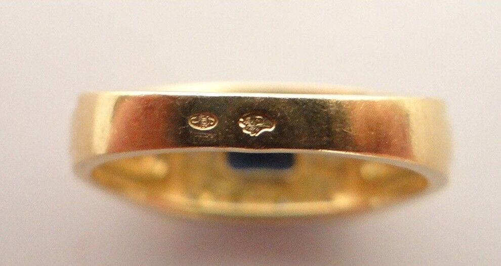 Poinçons or tête d'aigle 18K sur bague en or — expertise bijoux Paris